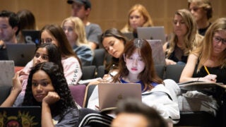 A class in an auditorium at USC Annenberg.