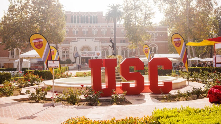 Alumni Park decorated with large red letters spelling 