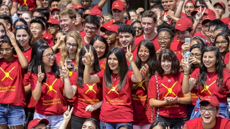 Students taking pictures at USC event.